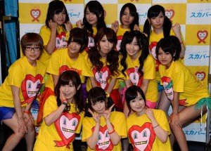 Nine Japanese porn actresses, (middle, from left to right) Kotone Nishida, Iku Sakuragi, Rina Serino, Yui Kasugano and Nodoka Otsuka, (rear, left to right) Yuria Kitahara, Riku Nekota, Yumena Muro and Karin Natsumi, pose with three supporters (front) in Tokyo on Saturday while preparing to have their breasts squeezed by fans for 24 hours over the weekend in the Boob Aid charity event. The nine adult movie stars told local media last week that they could barely contain their excitement about the Stop! AIDS campaign event — which was televised live — but asked, perhaps somewhat optimistically: Please be gentle. 